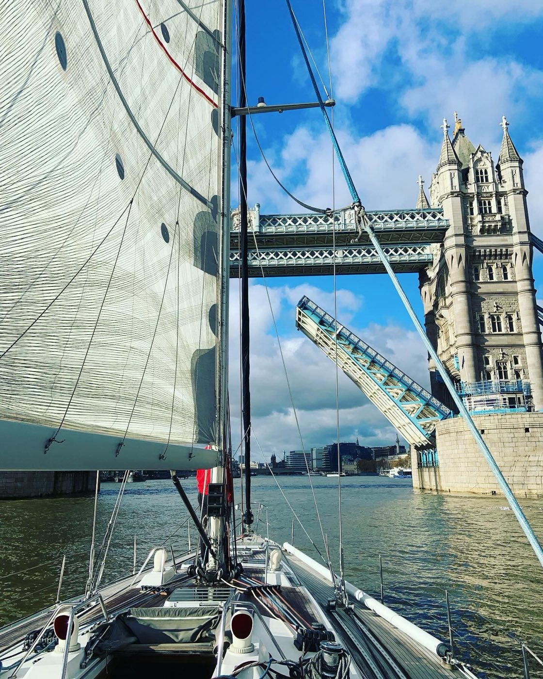 Sailing under Tower Bridge with the bascules raised